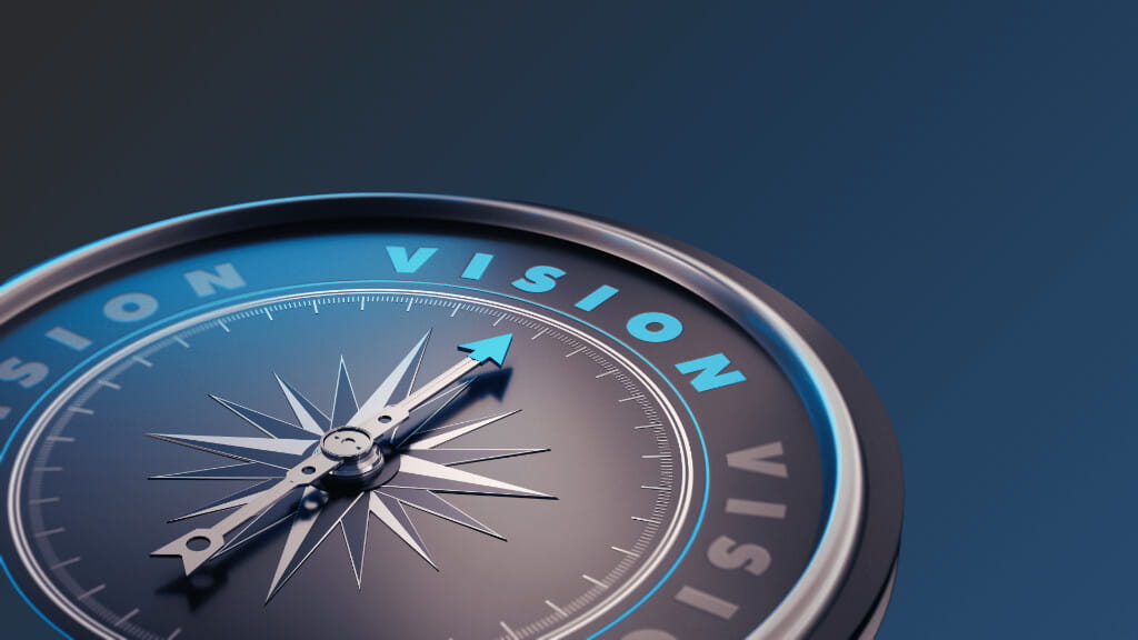 Business vision and strategic direction represented by a compass pointing forward