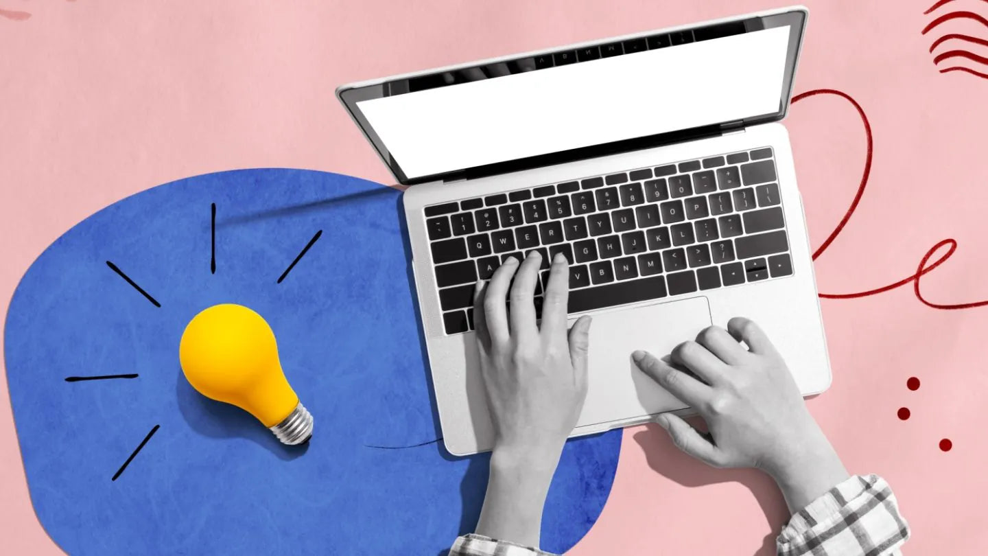 Content writing and creative ideas shown by a person typing on a laptop with a lightbulb concept